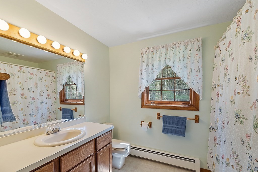 20 Rhodes Road Princeton, MA 01541 - Photo 20 of 35 a bathroom with a sink toilet and a mirror
