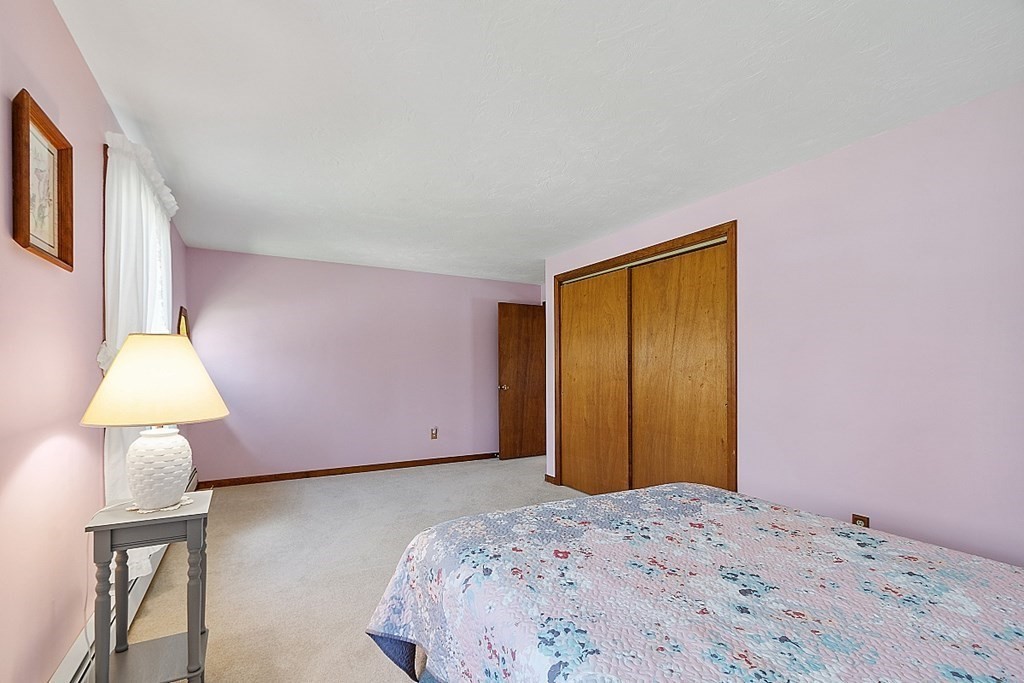 20 Rhodes Road Princeton, MA 01541 - Photo 23 of 35 a bedroom with a bed and a table in it