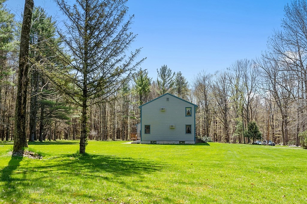 20 Rhodes Road Princeton, MA 01541 - Photo 33 of 35 a view of a backyard with large trees