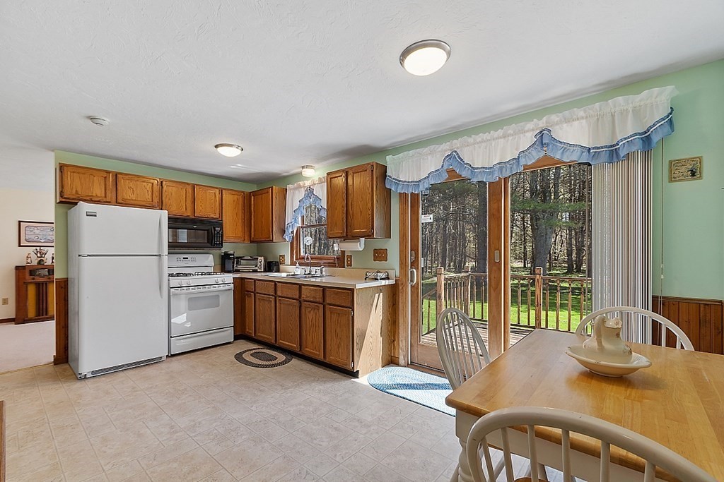 20 Rhodes Road Princeton, MA 01541 - Photo 7 of 35 a kitchen with refrigerator and cabinets