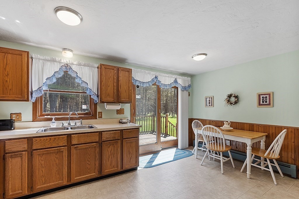20 Rhodes Road Princeton, MA 01541 - Photo 10 of 35 a kitchen with a sink dining table and chairs