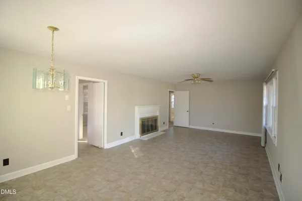 an empty room with a fireplace