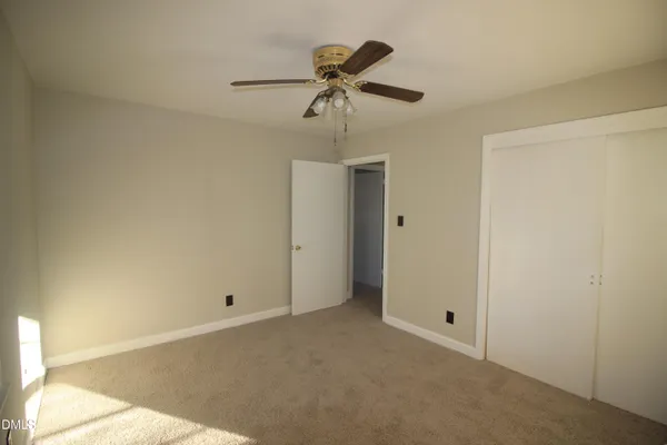 a view of room with ceiling fan