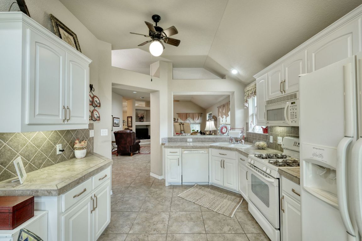 102 Texas Traditions Georgetown, TX 78628 - Photo 12 of 32 a kitchen with a sink cabinets and window
