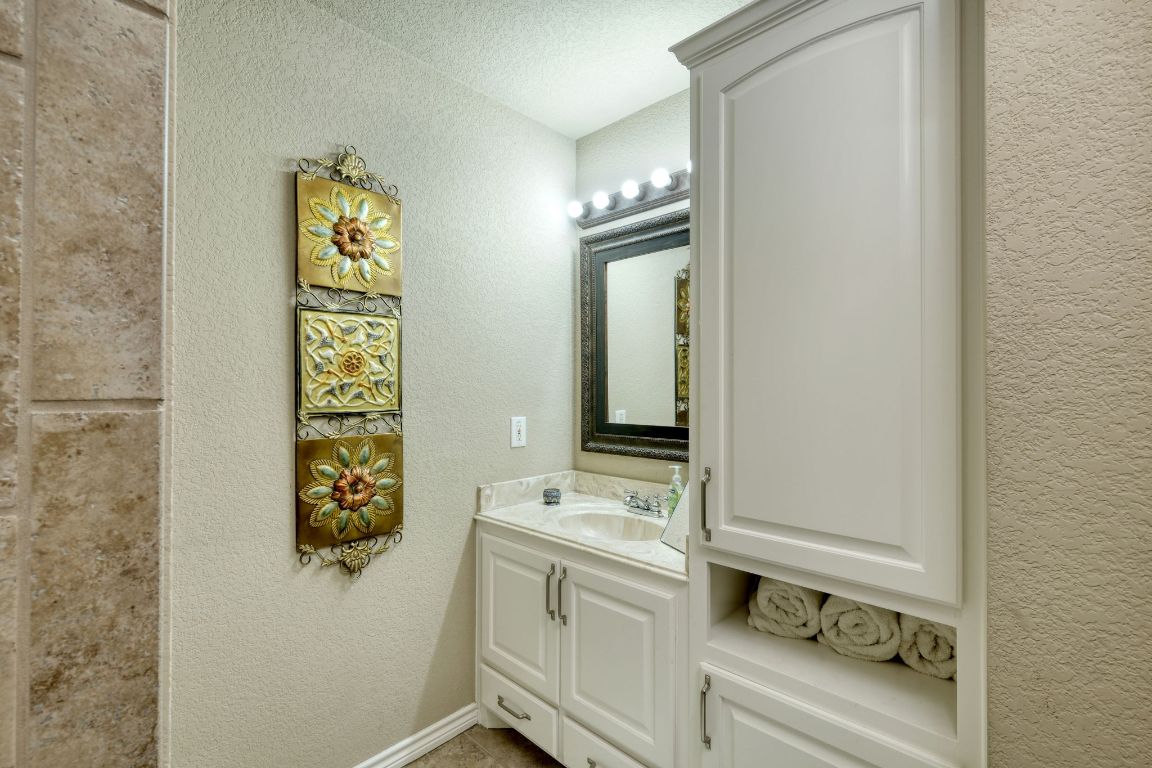 102 Texas Traditions Georgetown, TX 78628 - Photo 21 of 32 a bathroom with a sink and a mirror