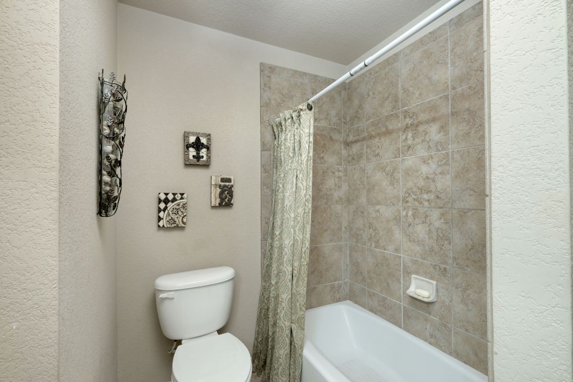 102 Texas Traditions Georgetown, TX 78628 - Photo 22 of 32 a bathroom with a toilet and a shower