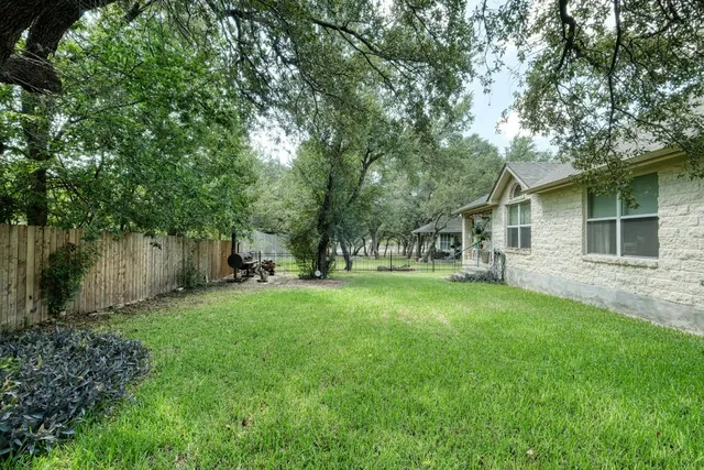 an aerial view of a house with outdoor space and street view