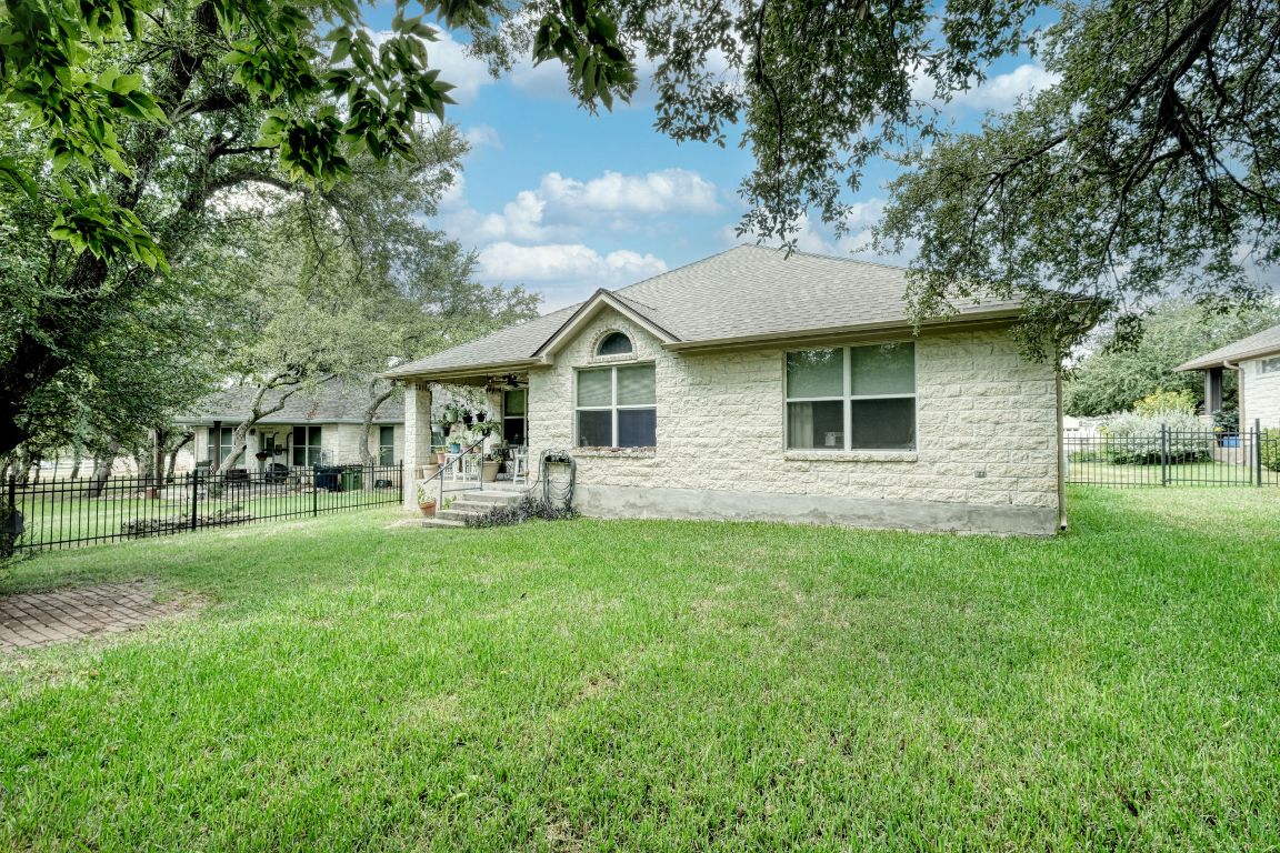 102 Texas Traditions Georgetown, TX 78628 - Photo 26 of 32 a view of a house with a big yard and large trees
