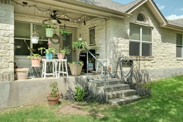 an aerial view of house with swimming pool and mountains