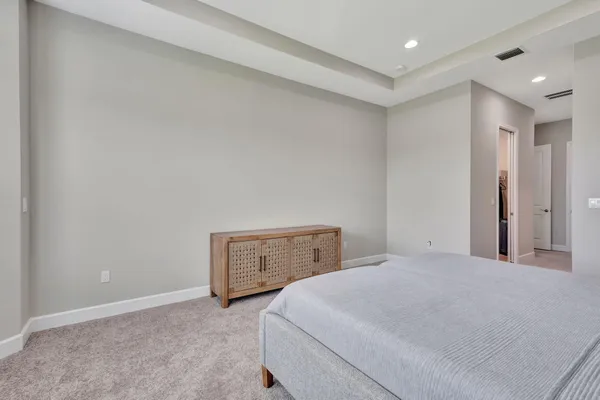 a bedroom with a bed and a table