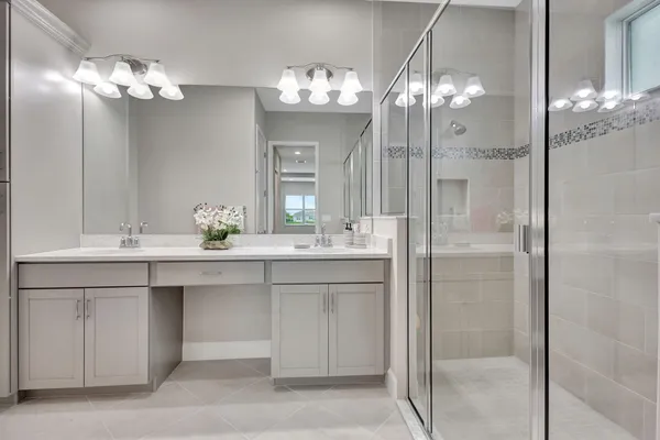 a bathroom with a sink vanity and a mirror
