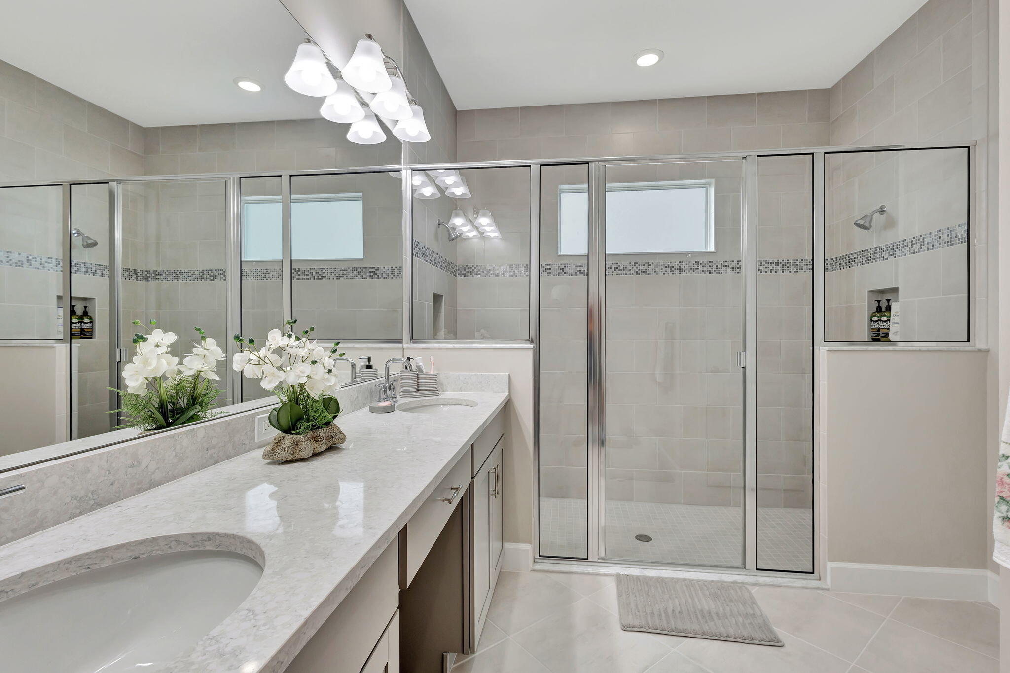 5403 Macoon Way Westlake, FL 33470 - Photo 17 of 51 a bathroom with a granite countertop sink a mirror and a shower