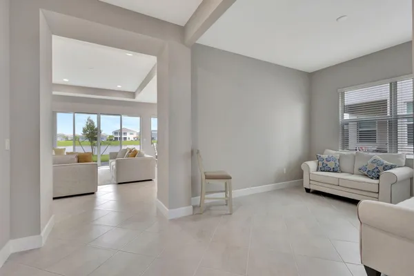 a living room with furniture and a large window
