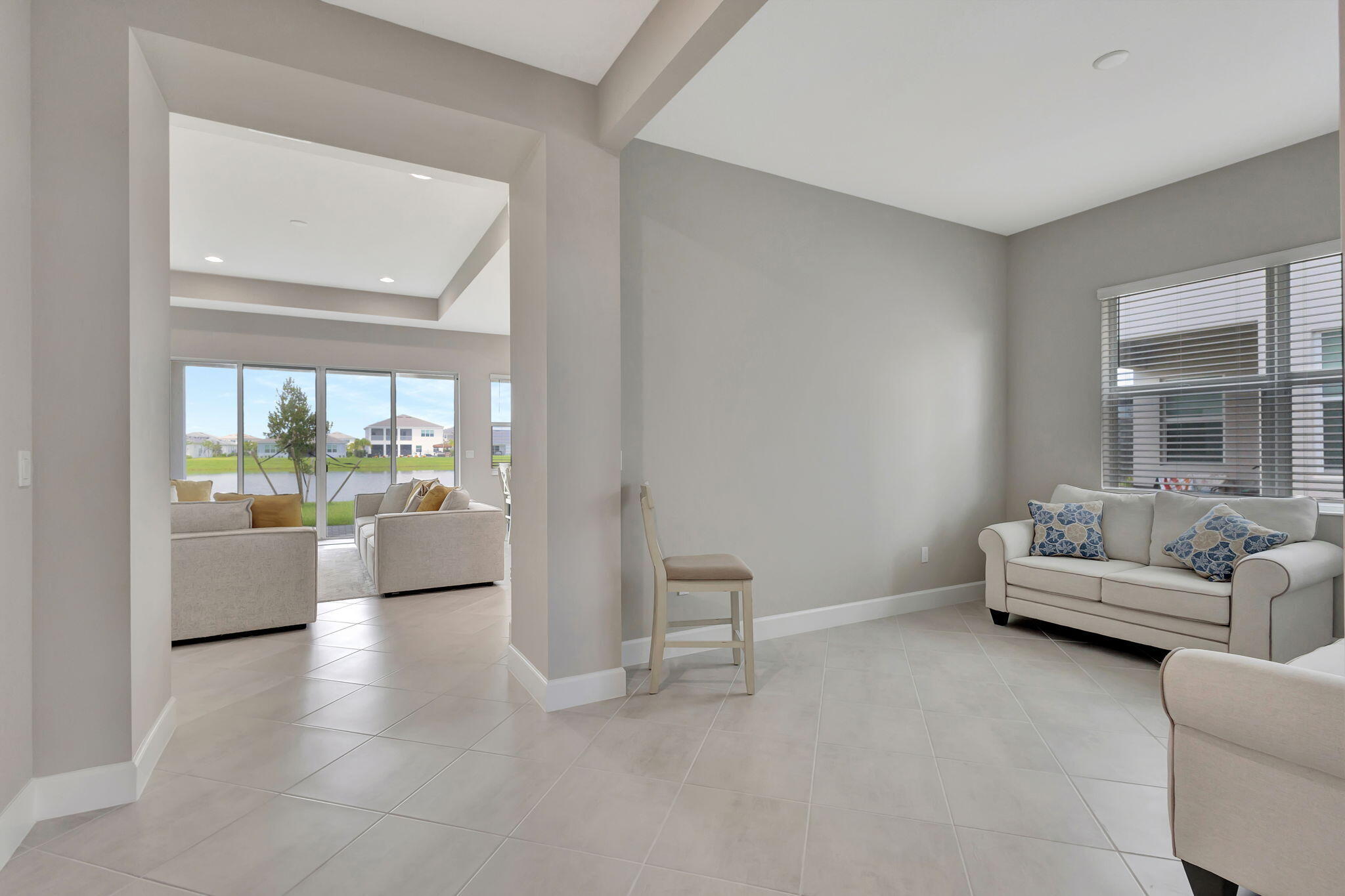 5403 Macoon Way Westlake, FL 33470 - Photo 21 of 51 a living room with furniture and a large window