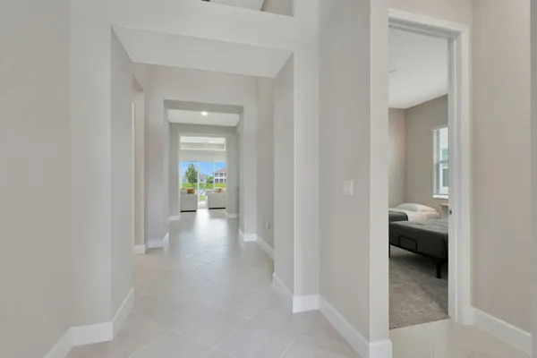 a view of a hallway and a livingroom with a furniture