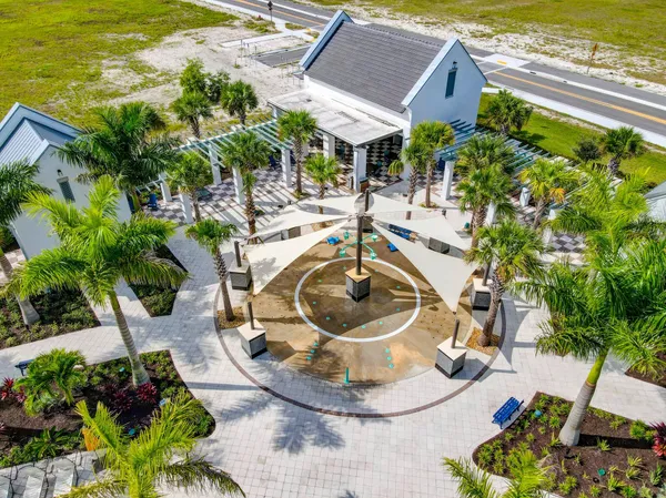 a view of a swimming pool with sitting area
