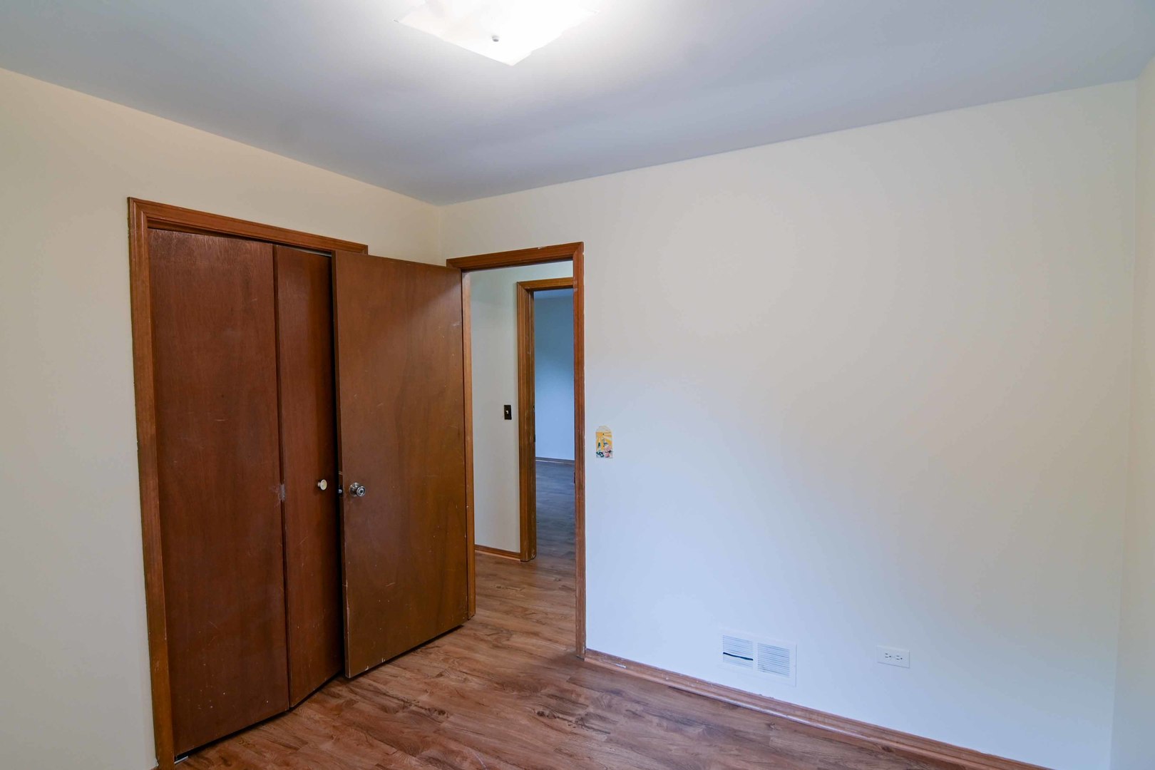 2729 Lowery Court Zion, IL 60099 - Photo 15 of 36 a view of a hallway with wooden floor