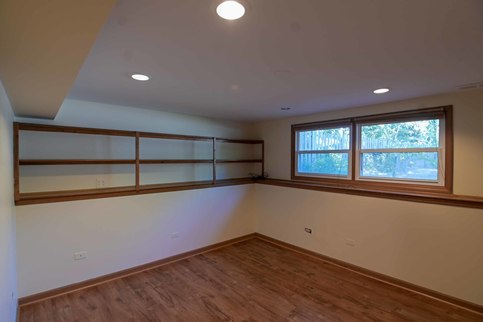 2729 Lowery Court Zion, IL 60099 - Photo 21 of 36 an empty room with wooden floor and windows