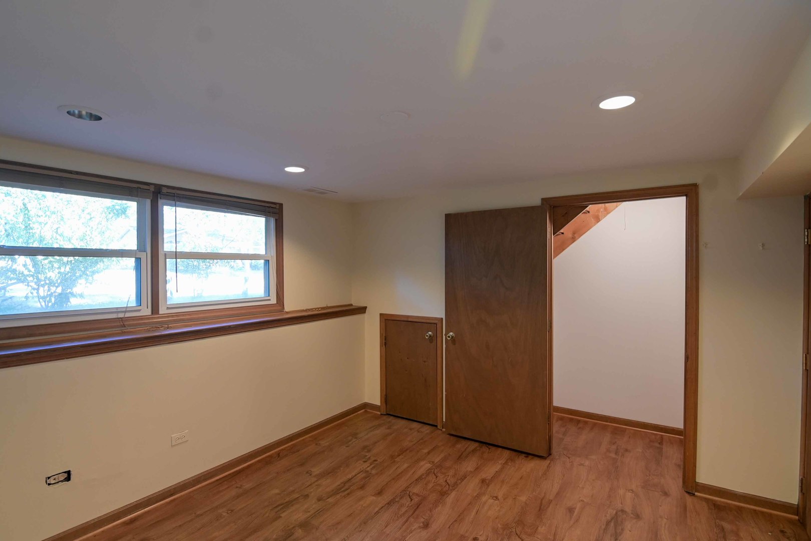 2729 Lowery Court Zion, IL 60099 - Photo 22 of 36 an empty room with wooden floor and windows