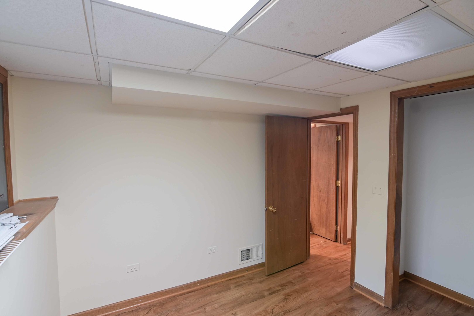 2729 Lowery Court Zion, IL 60099 - Photo 24 of 36 a view of an empty room with wooden floor