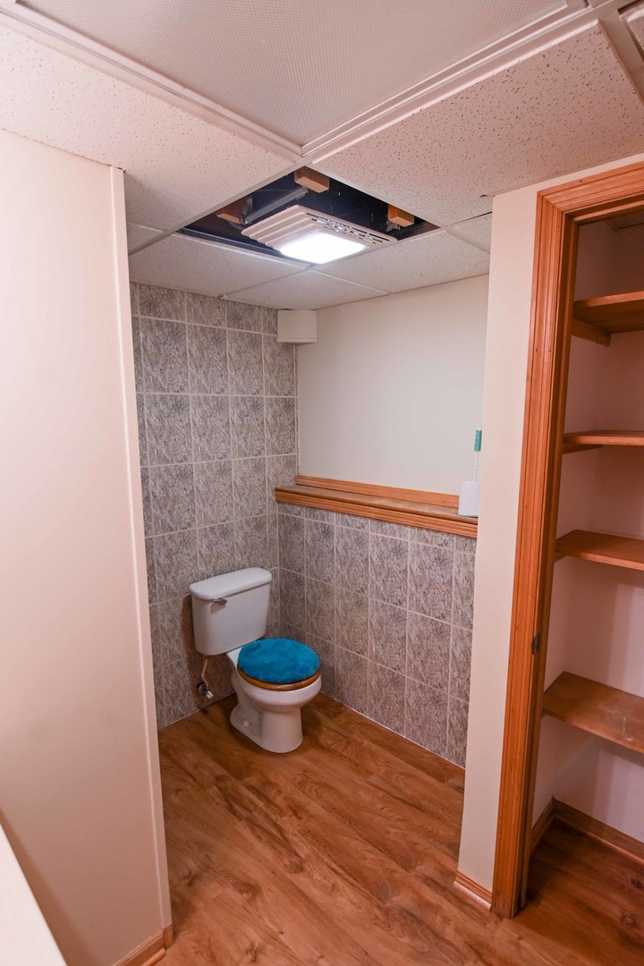 2729 Lowery Court Zion, IL 60099 - Photo 26 of 36 a view of empty room with wooden floor and chair