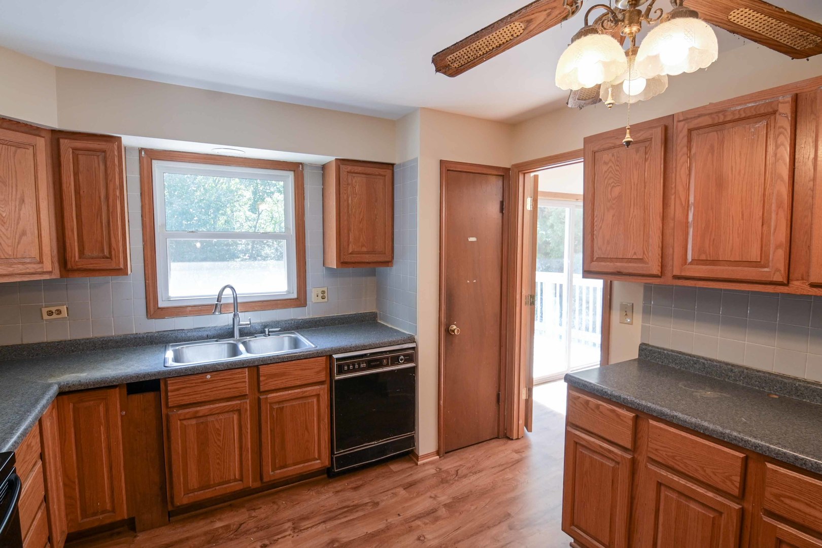 2729 Lowery Court Zion, IL 60099 - Photo 5 of 36 a kitchen with stainless steel appliances granite countertop a sink stove and refrigerator