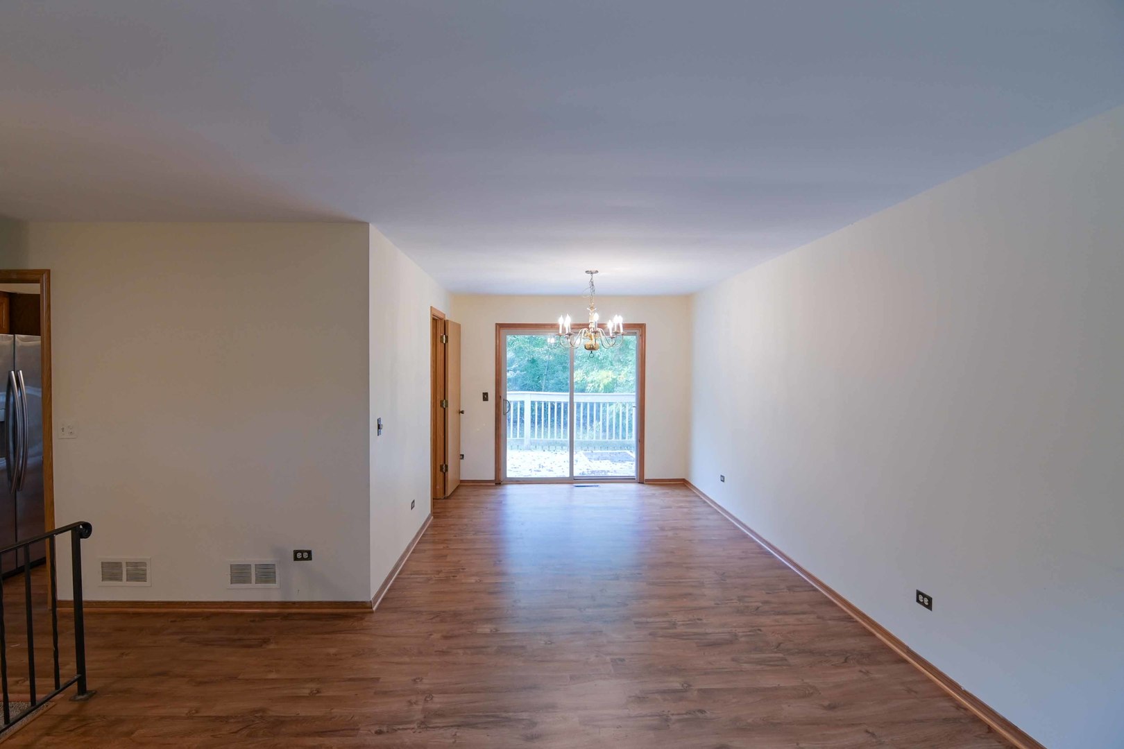 2729 Lowery Court Zion, IL 60099 - Photo 8 of 36 a view of a room with wooden floor and large window