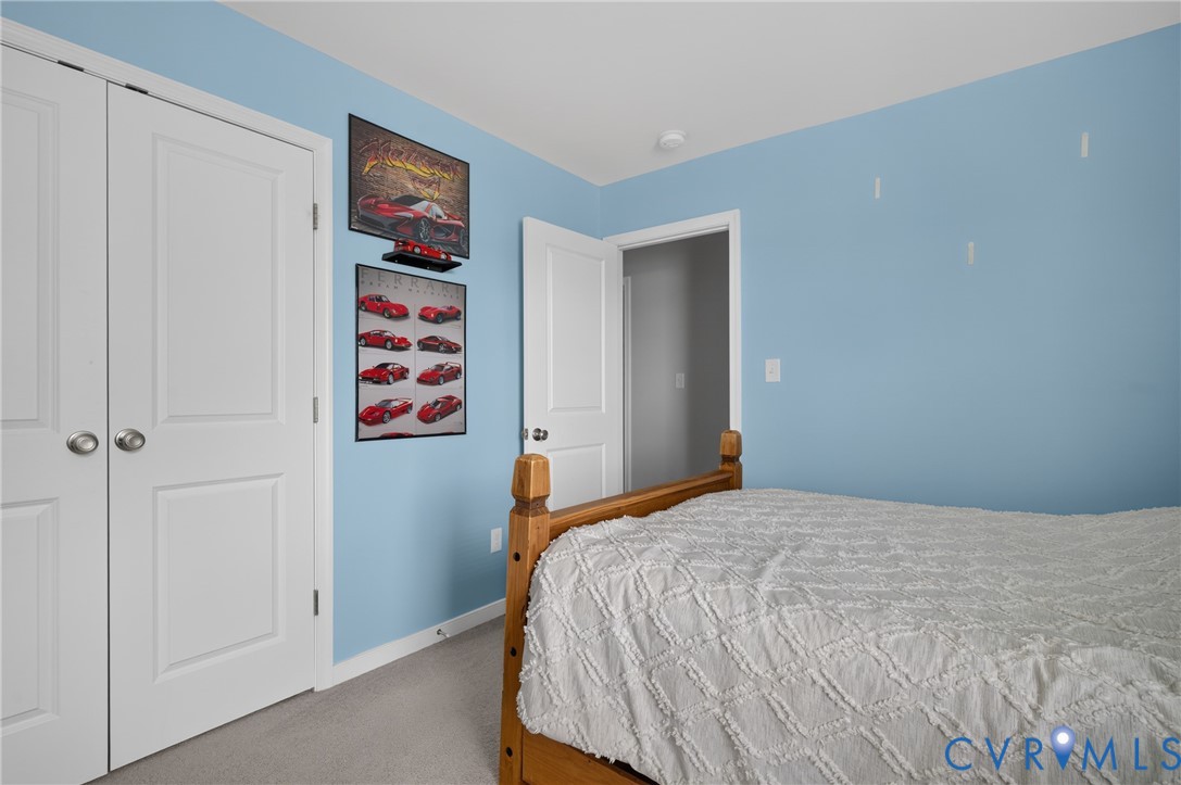 311 Cardinal Road Louisa, VA 23093 - Photo 31 of 39 Bedroom featuring light blue walls and neutral car