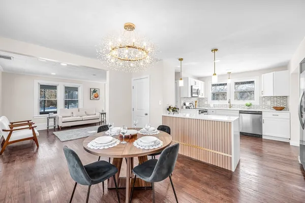 a kitchen with a dining table and chairs