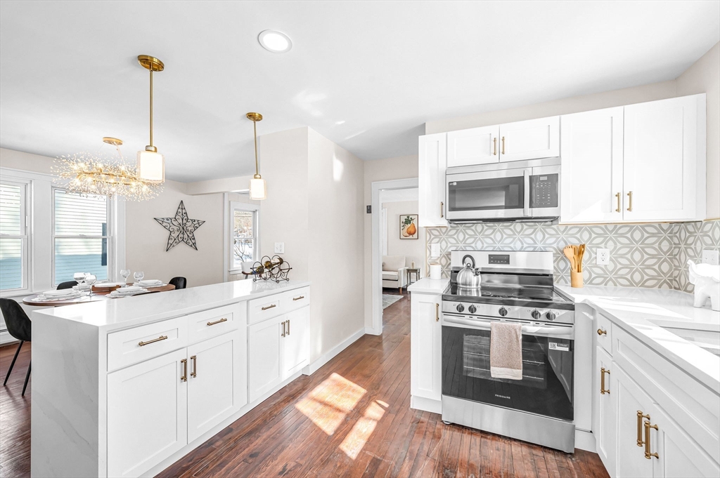 20 Walnut Street Gill, MA 01354 - Photo 13 of 42 a kitchen with a stove a sink and a microwave