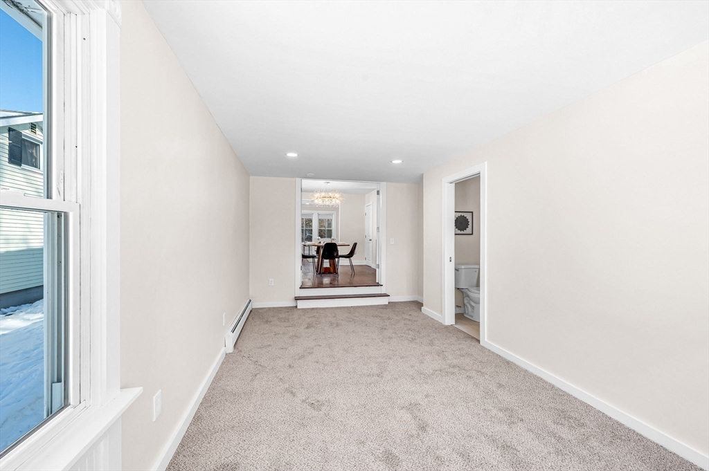20 Walnut Street Gill, MA 01354 - Photo 23 of 42 a view of a livingroom and a kitchen with furniture and a hallway