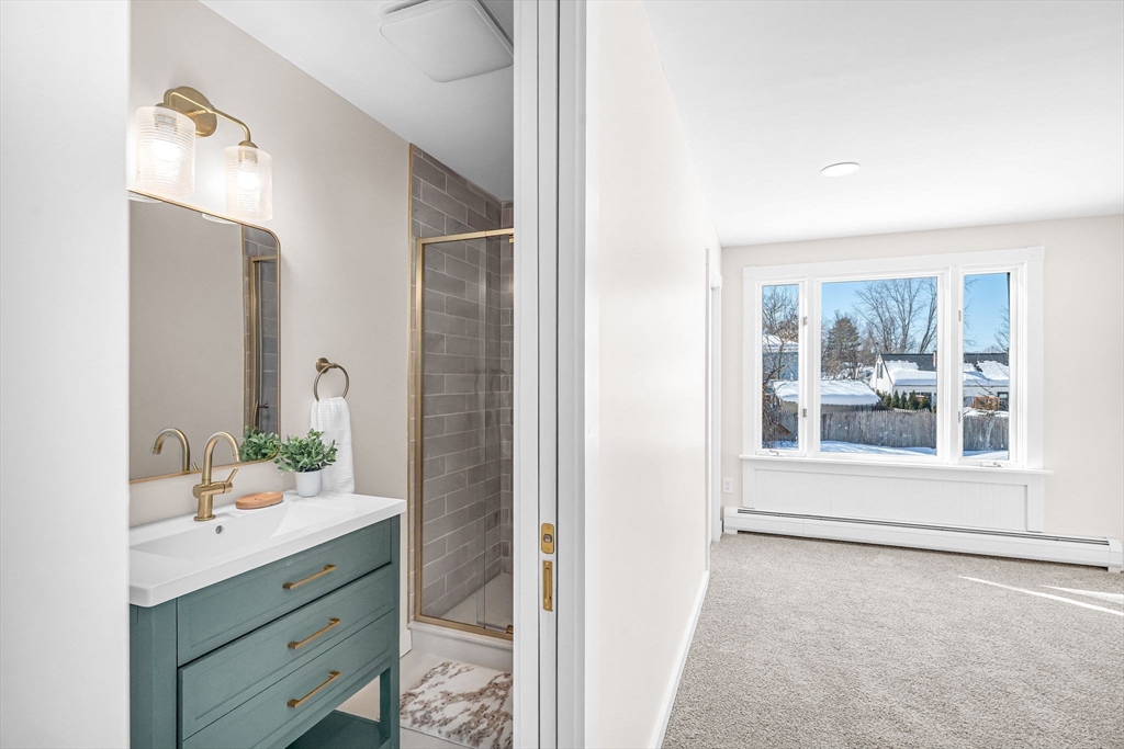 20 Walnut Street Gill, MA 01354 - Photo 24 of 42 a bathroom with a sink mirror and a shower