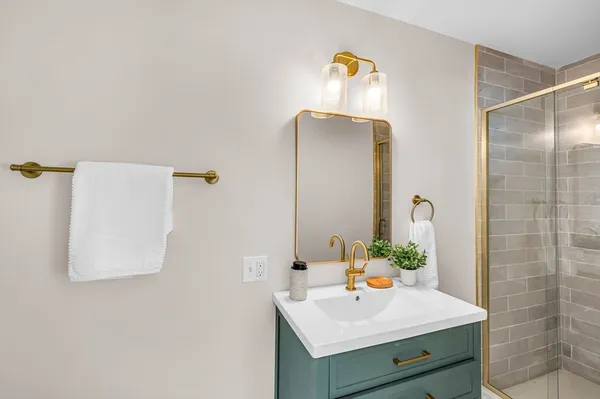 a bathroom with a sink and a mirror