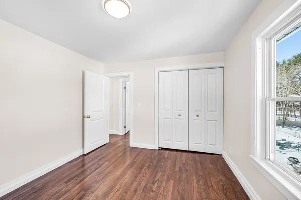a view of a livingroom with wooden floor