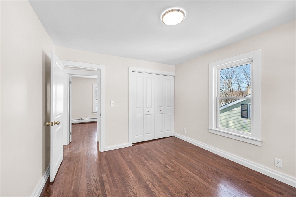 20 Walnut Street Gill, MA 01354 - Photo 33 of 42 an empty room with wooden floor and windows