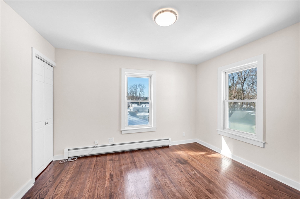 20 Walnut Street Gill, MA 01354 - Photo 34 of 42 an empty room with wooden floor and windows