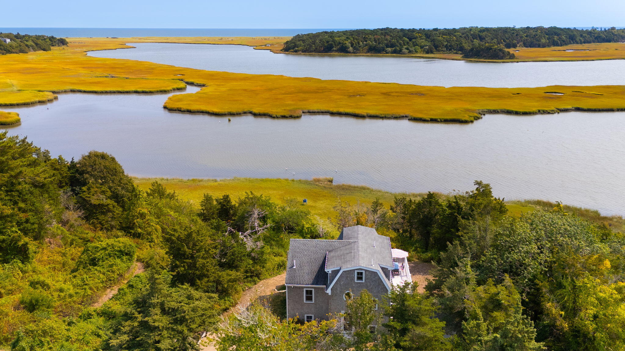 63 Briar Spring Road Orleans, MA 02653 - Photo 2 of 37 a view of an ocean and beach