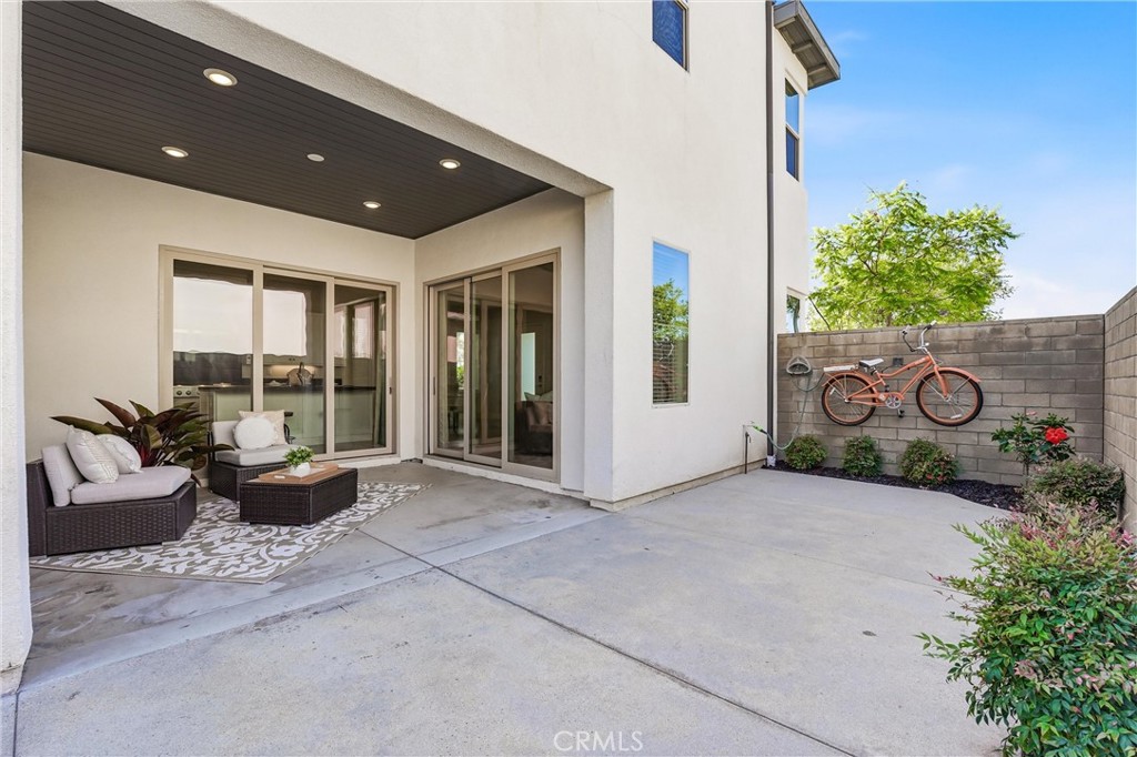 182 Scale Irvine, CA 92618 - Photo 25 of 61 Covered patio, open courtyard, a cruiser bike on the wall. This outdoor space has personality and room to live in it.
