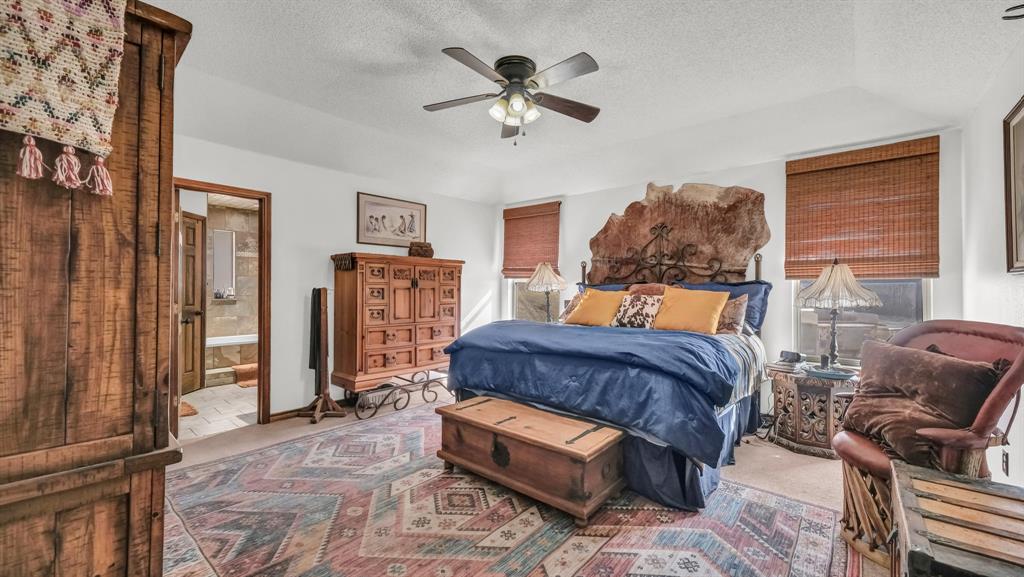 351 Don Propp Road Azle, TX 76020 - Photo 13 of 36 a bedroom with a bed dresser and a window