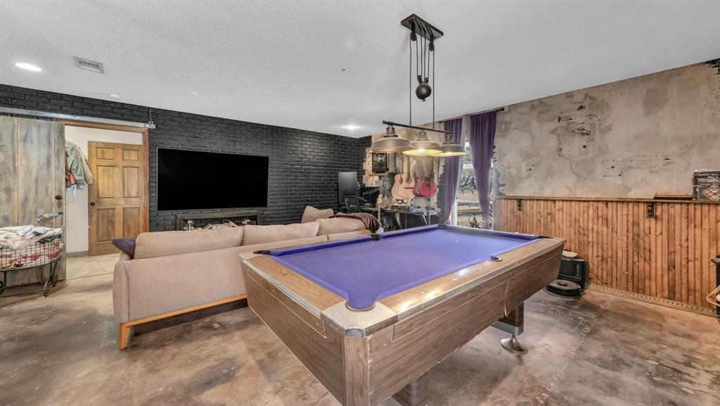 351 Don Propp Road Azle, TX 76020 - Photo 20 of 36 a room with furniture and flat screen tv