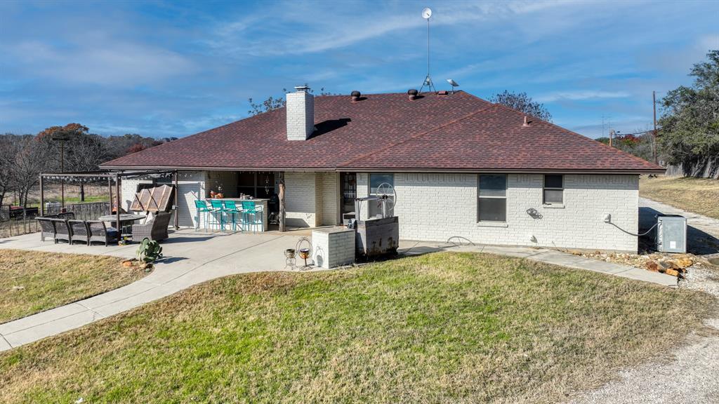 351 Don Propp Road Azle, TX 76020 - Photo 29 of 36 a house view with a sitting space and garden