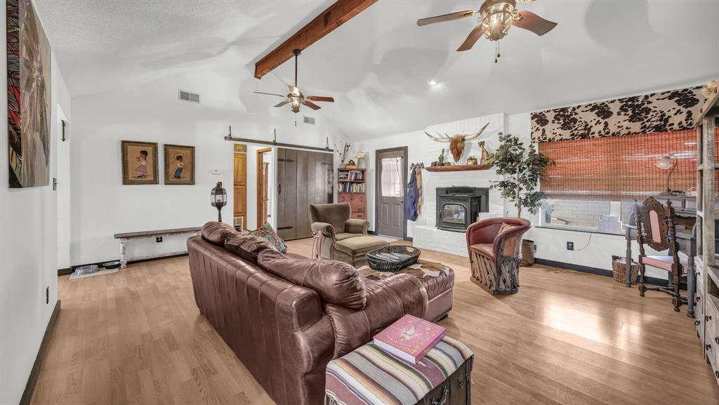 351 Don Propp Road Azle, TX 76020 - Photo 5 of 36 a living room with furniture a flat screen tv and a large window