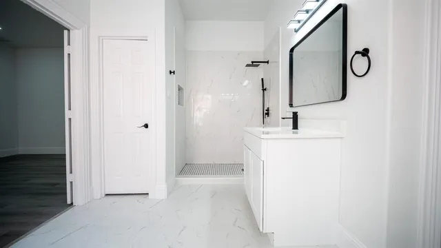 a bathroom with a sink and a mirror