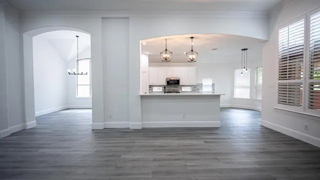 a view of kitchen with wooden floor and window