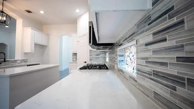 a kitchen with stainless steel appliances a refrigerator and a sink