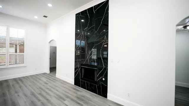 a view of hallway with wooden floor