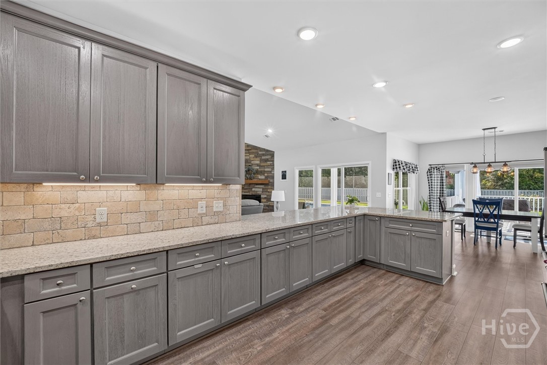 1260 Little McCall Road Guyton, GA 31312 - Photo 14 of 62 Tons of counterspace in this great kitchen. Access to both the pergola area and the screened porch. Perfect for entertaining