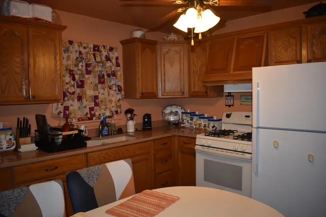 a kitchen with a sink a stove and refrigerator
