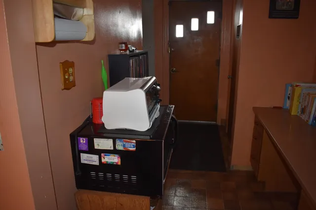 a bathroom with a toilet and a mirror