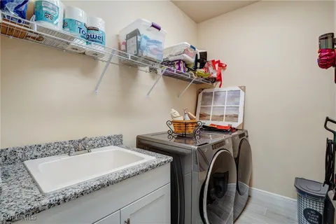 a balcony with furniture and large windows